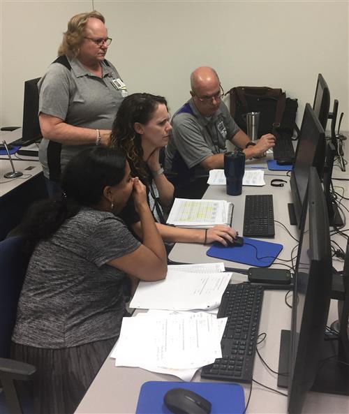 Computer Science teachers collaborating. 