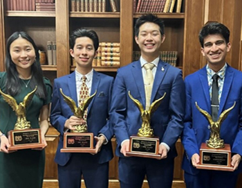  PSHS Speech & Debate winners holding large trophies