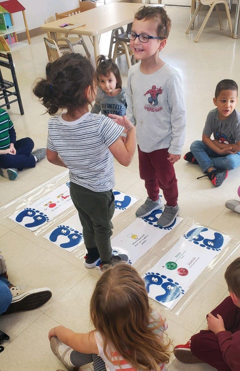 children smiling at one another