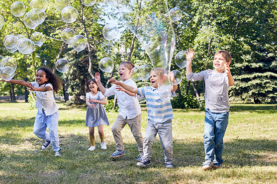 Children playing with bubbles