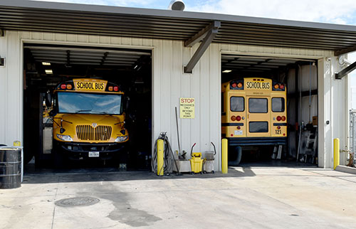Buses inside transportation garage in Plano ISD.
