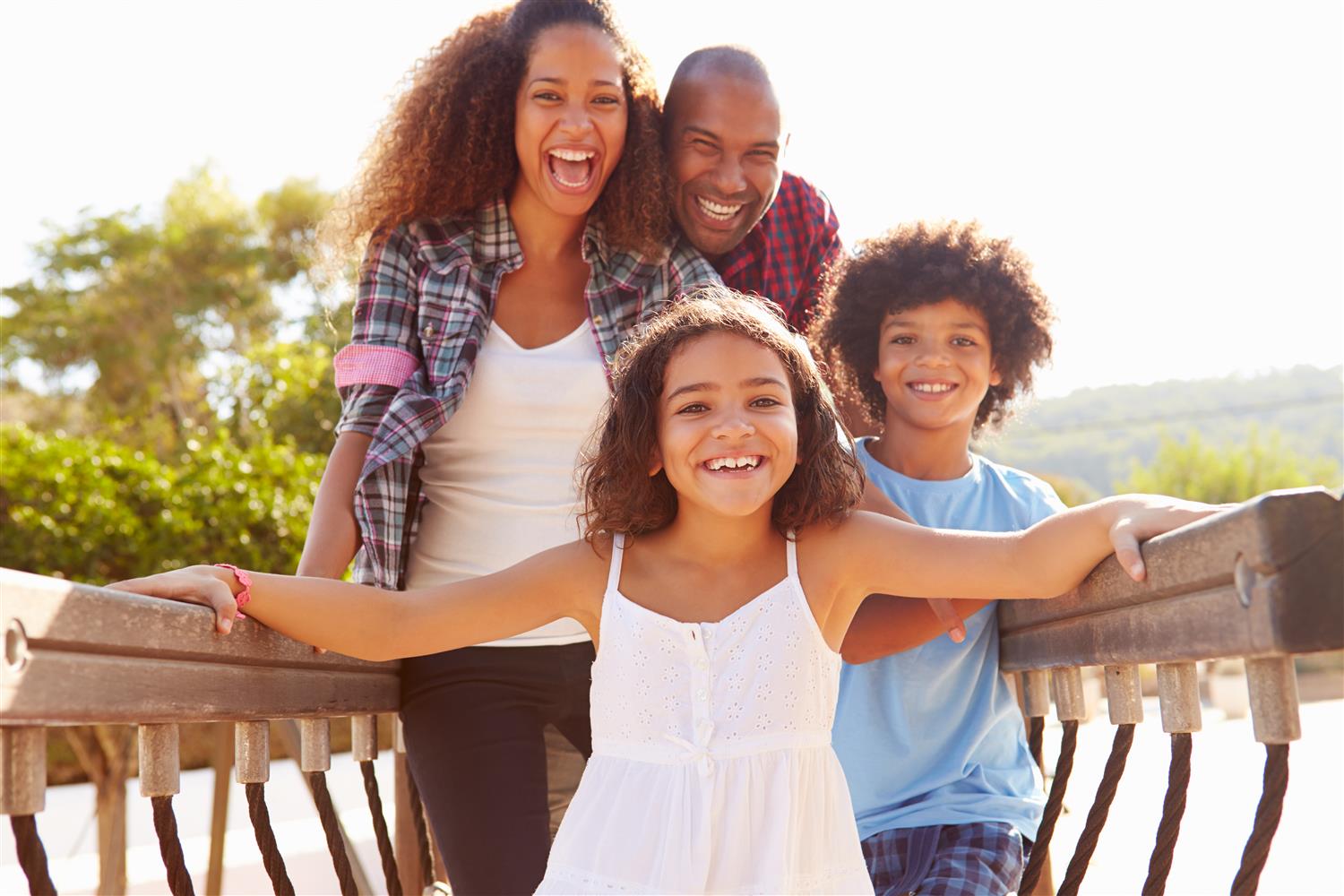 Family of 4 smilling 