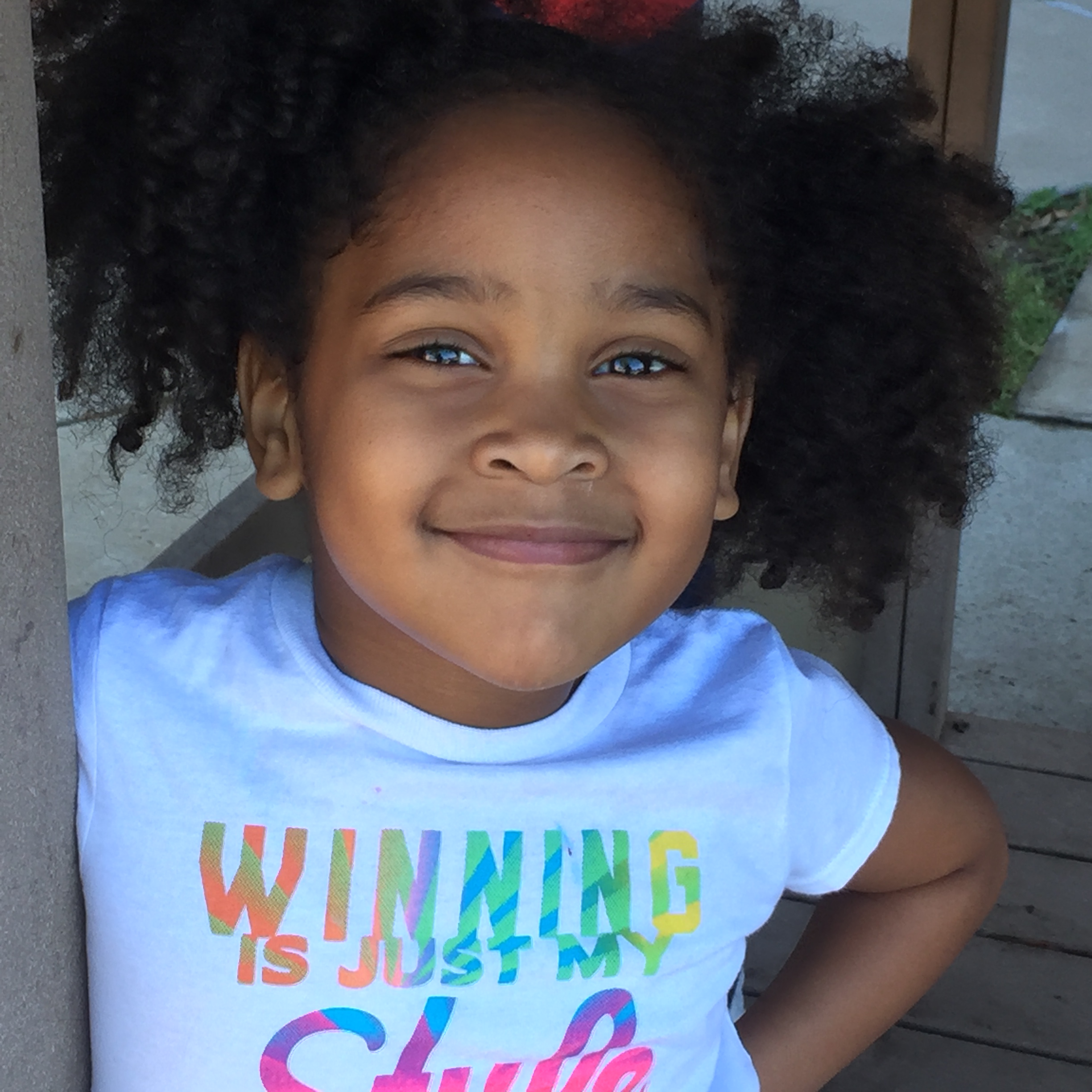 close up of little african american elementary girl smiling 