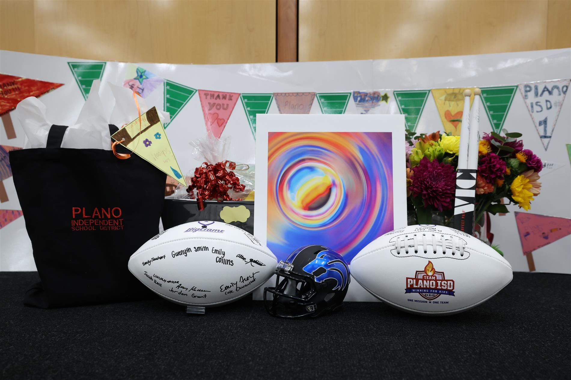 composite photo of gifts provided to the Plano ISD Board of Trustees from student groups across the district