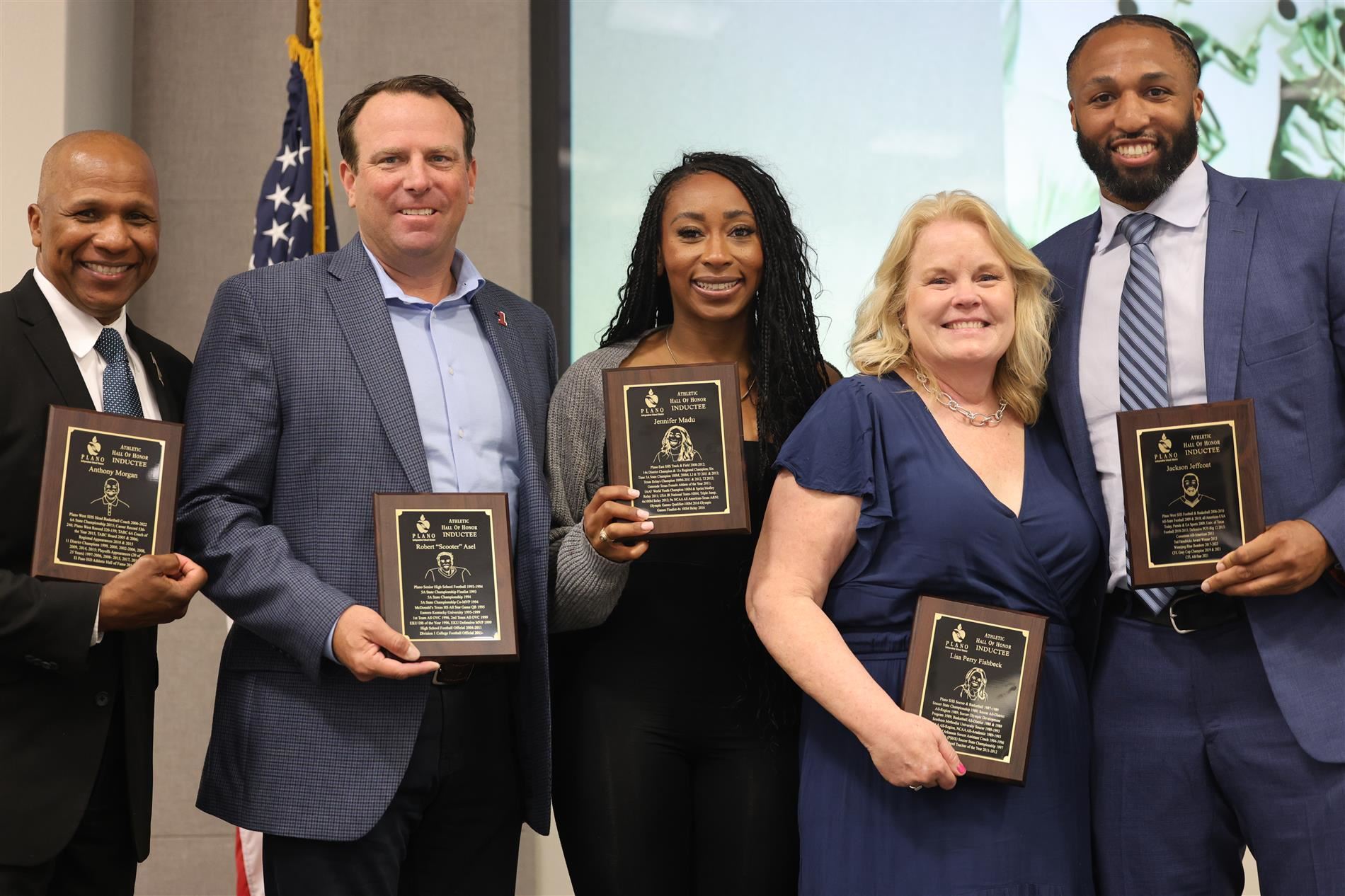 Image of 2024 Hall of Honor Inductees with plaques.
