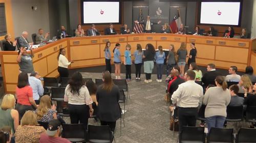 Board President Stolle asking former Davis Dolphins in the crowd to stand
