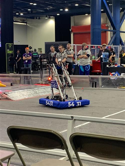 Academy High School's robot performing at a local tournament