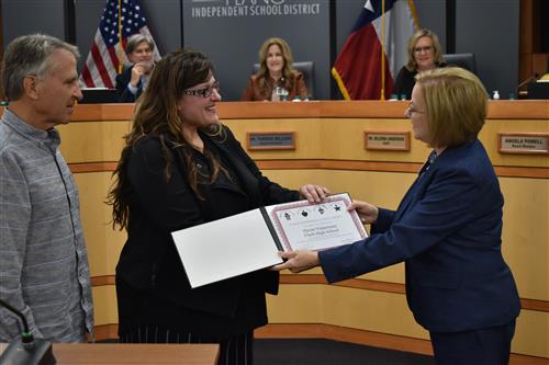 Nicole Vickerman being presented award by Board Vice President Nancy Humphrey