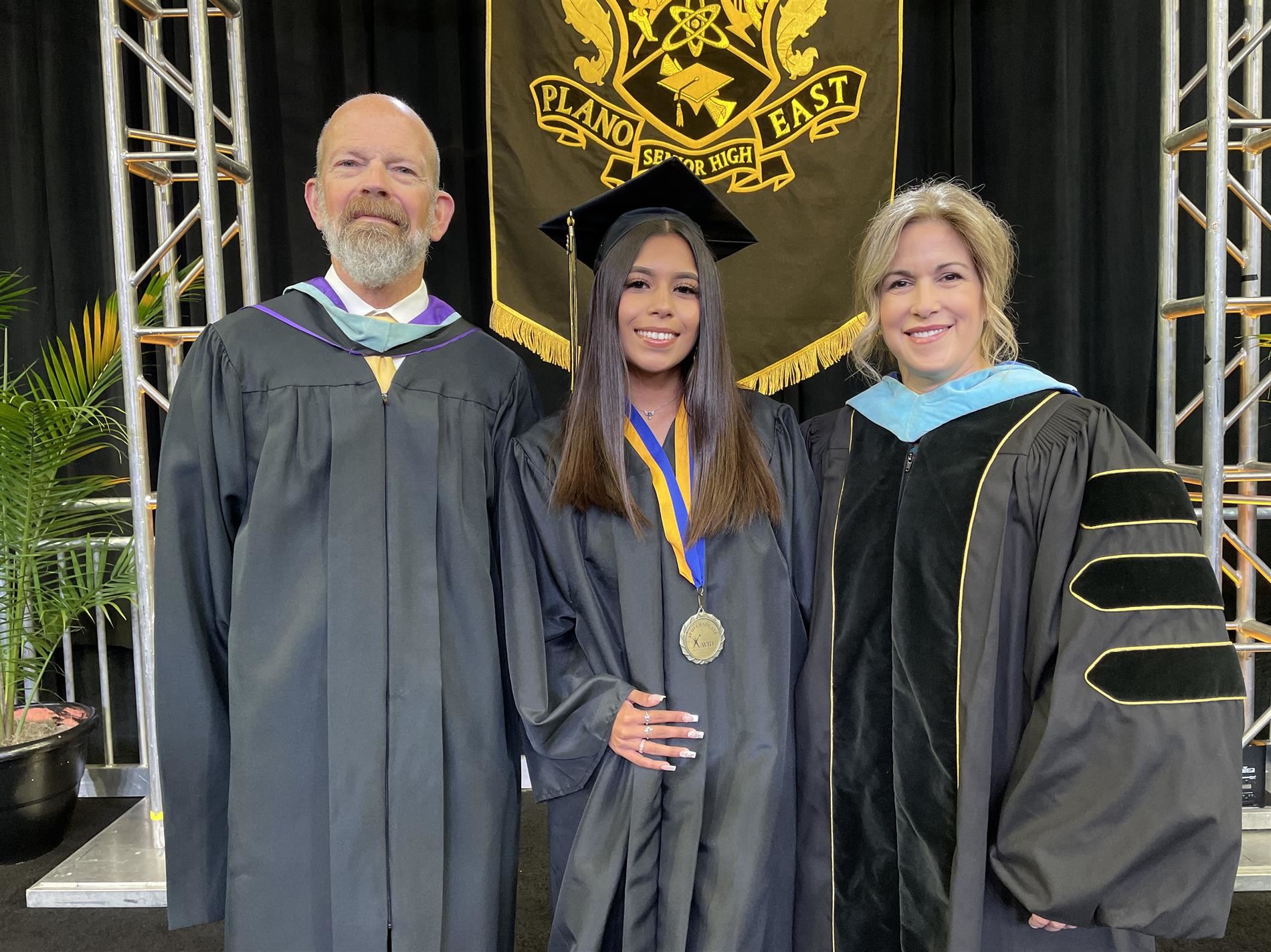 Honoree  with superintendent and principal