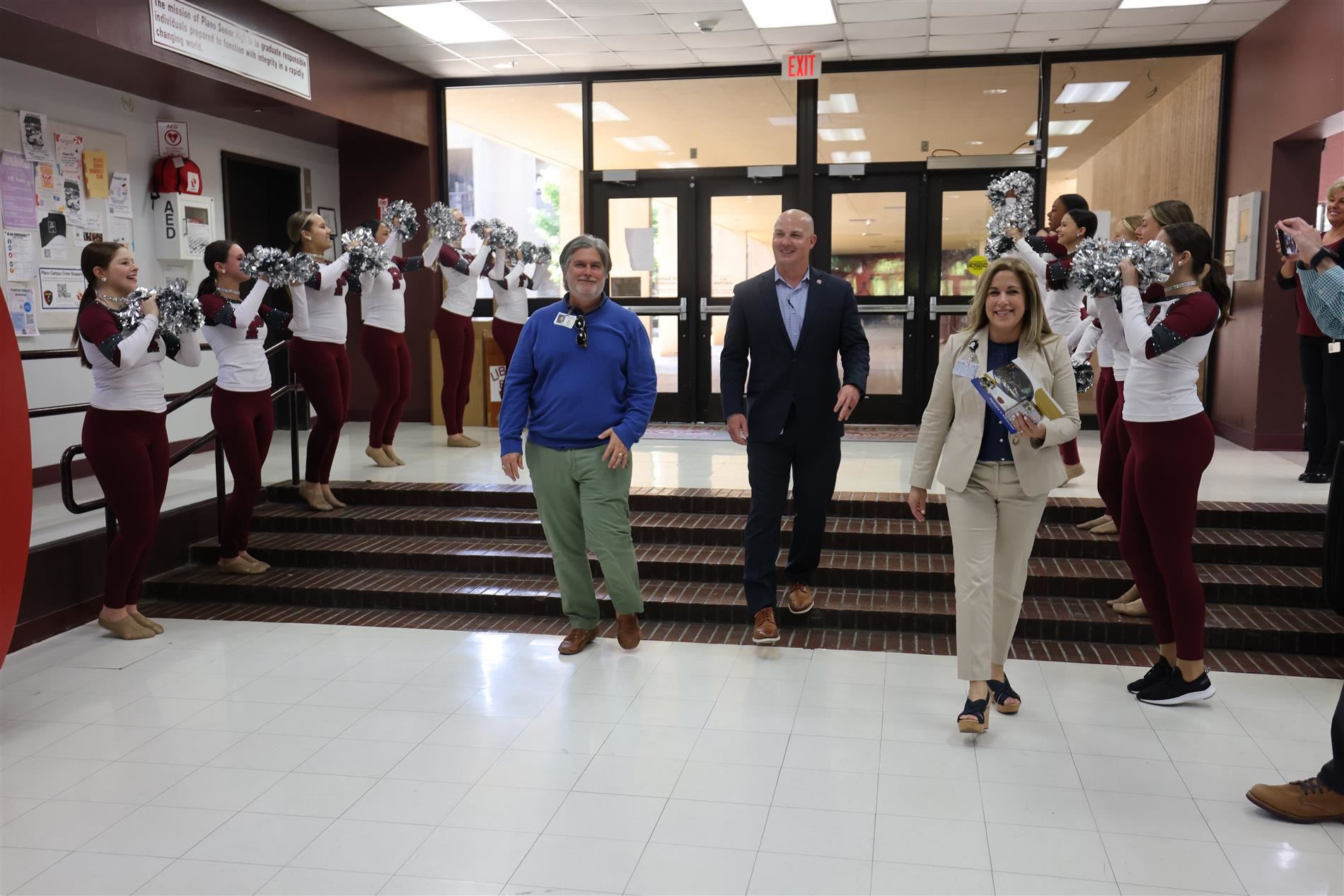 President Stolle entered Plano Senior High cafeteria for a surprise ceremony.