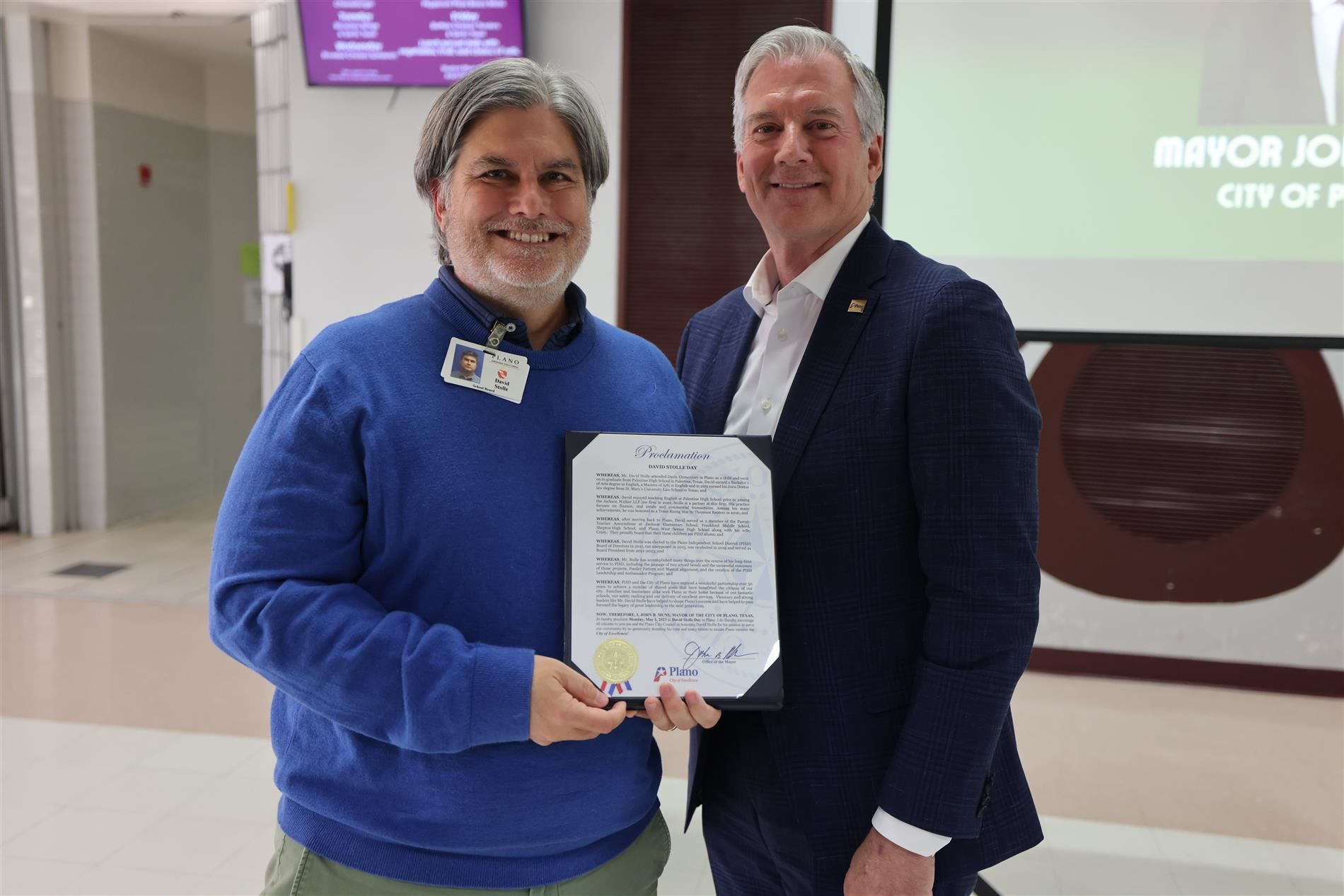  Retiring Board President Stolle with Plano Mayor John Muns and proclamation.