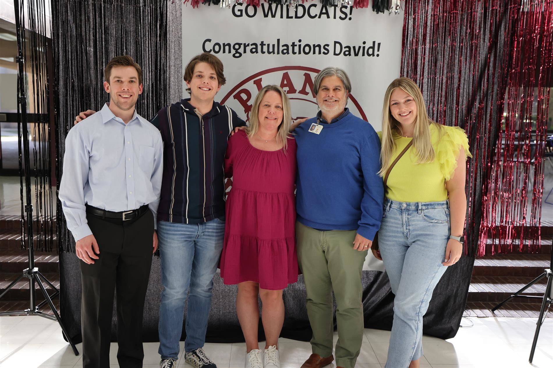 President Stolle posing for photos with his family.