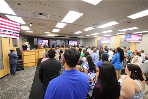 Board of Trustees leading in the pledge of allegiance
