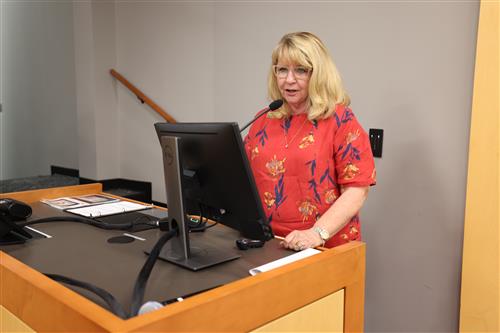 woman speaking at the podium