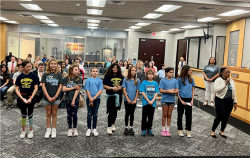 Davis elementary school students perform the pledges of allegiance