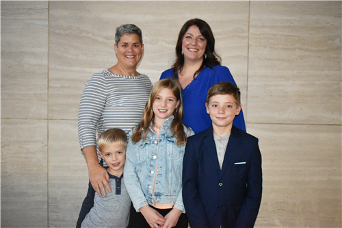 Laura Zimmer (Right) with her wife and children