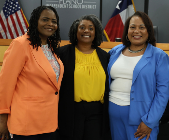 three new staff appointments posing at the May 6 board meeting