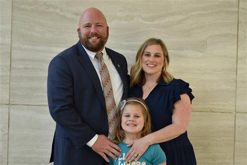 Dr. Phillip Morgan with his wife and daughter