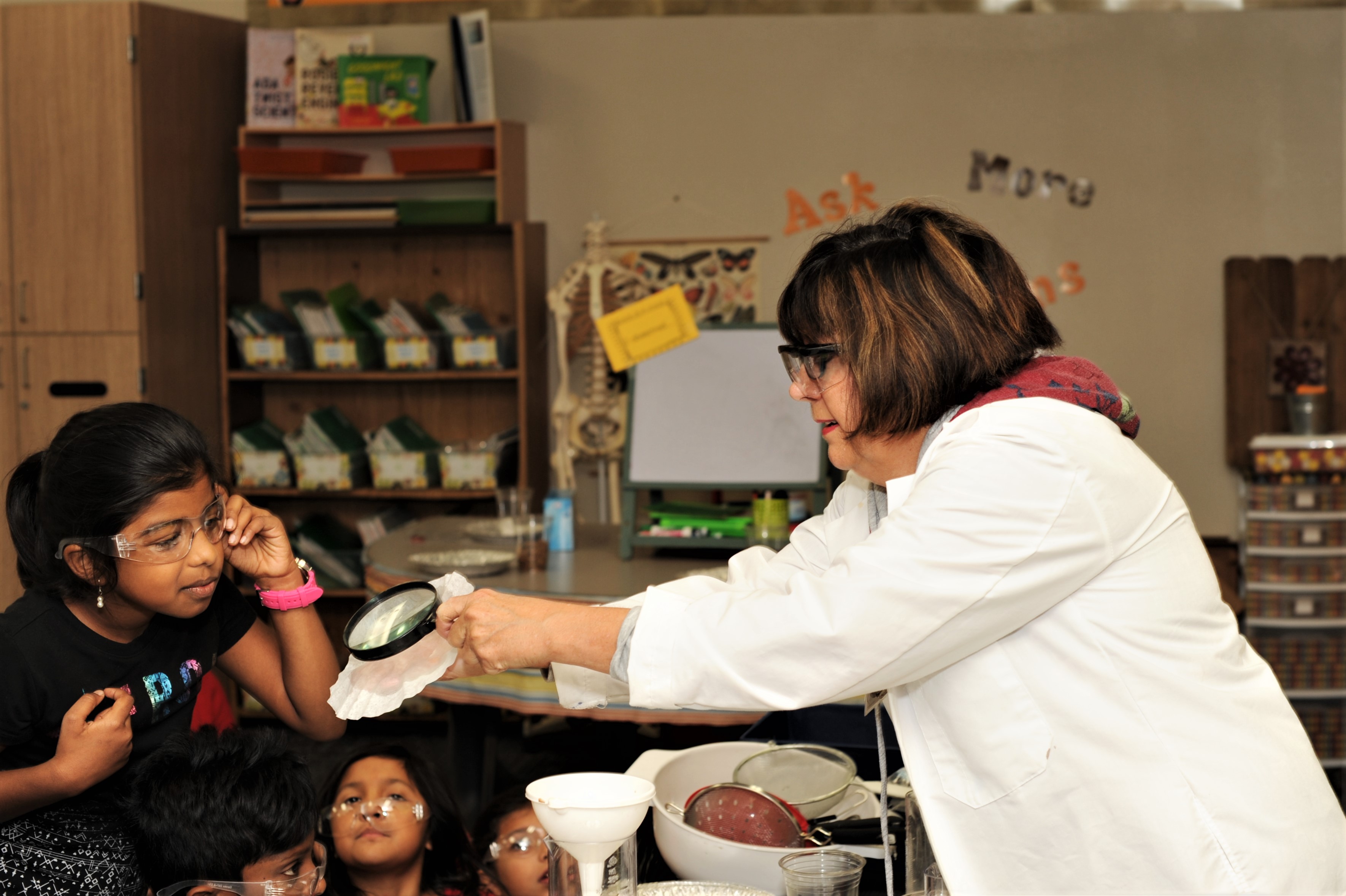 Teacher and student inspecting a filter 