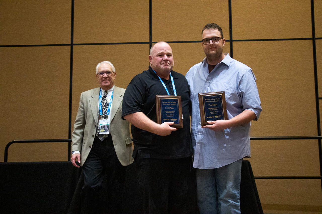 Plano ISD Bus Drivers with national award plaques 