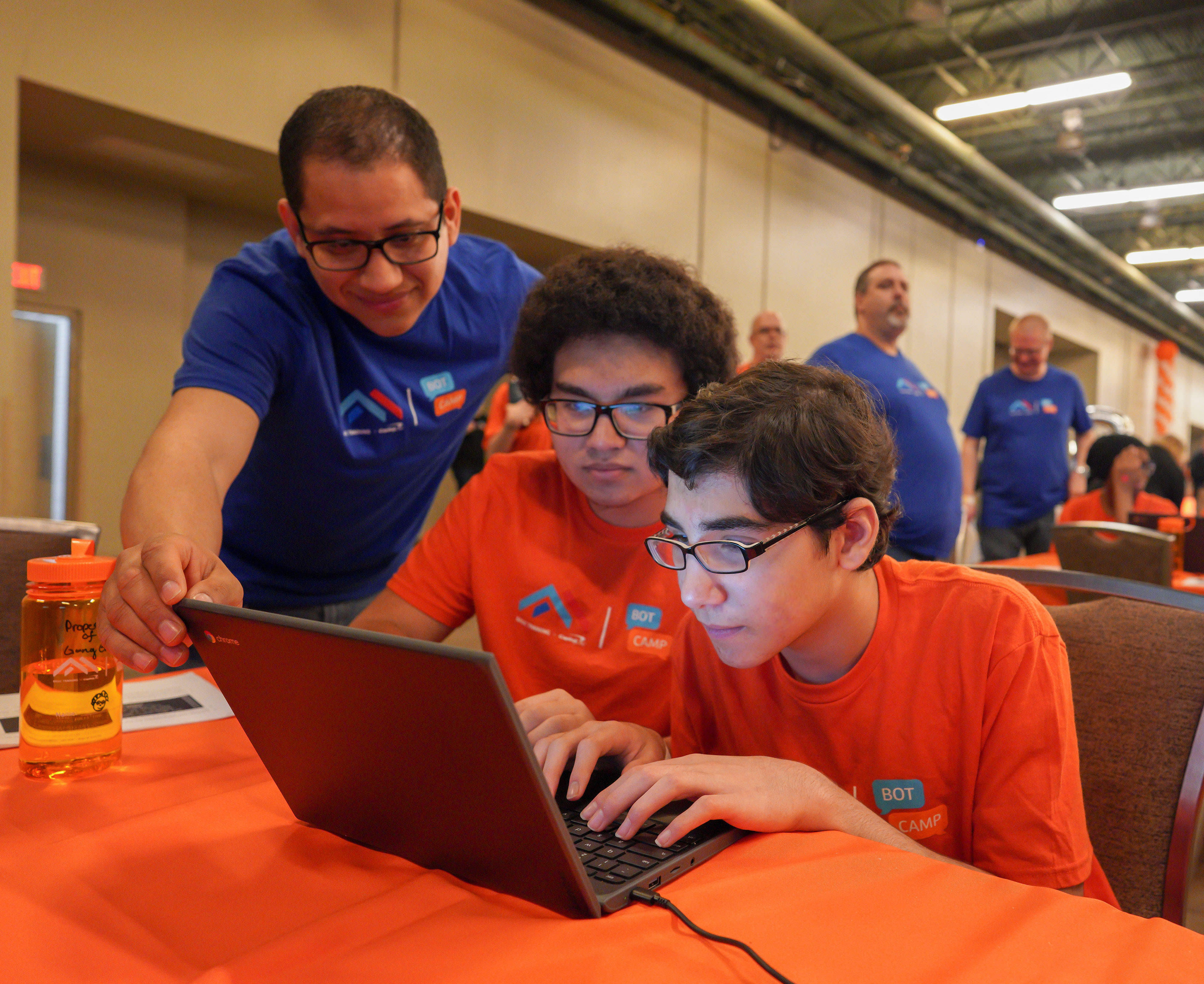 2 Clark students coding at Bot Camp 