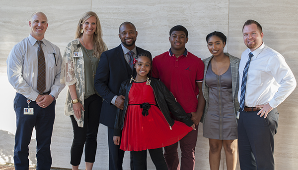 Derrian McKinney with children and Frankford /Jasper principals 