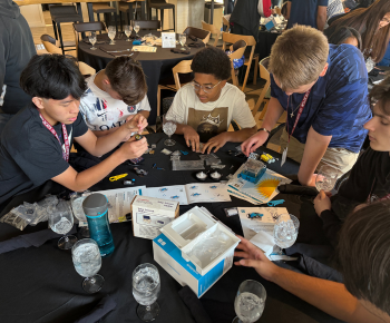  Students reading instructions on how to build a solar science station