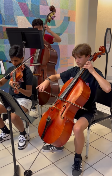 Orchestra students playing during Open House