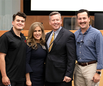  Todd Williams, wife and 2 sons in boardroom