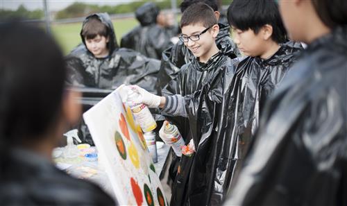 Students spray painting  