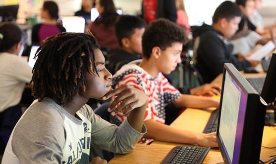 students sitting in computer lab 