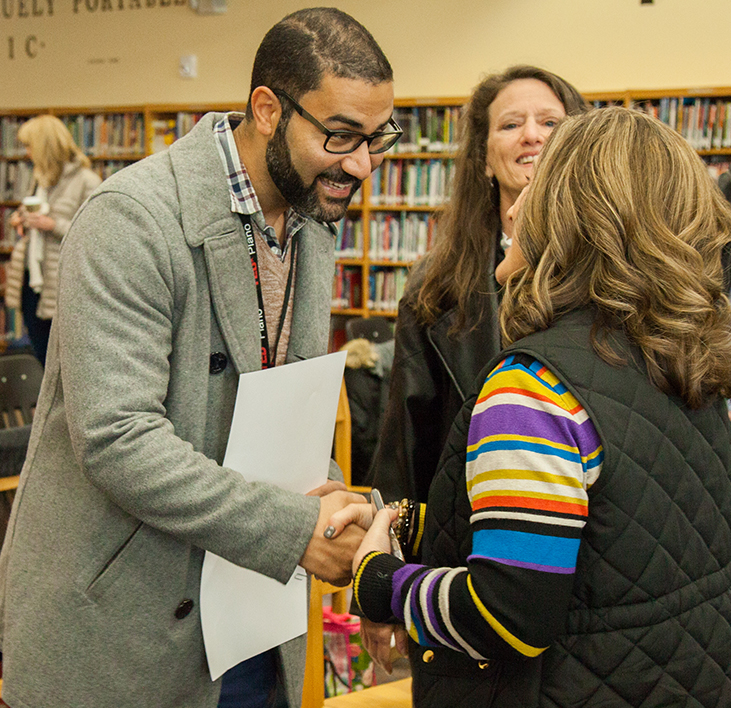  Grant winning teacher shaking hands with foundation staff