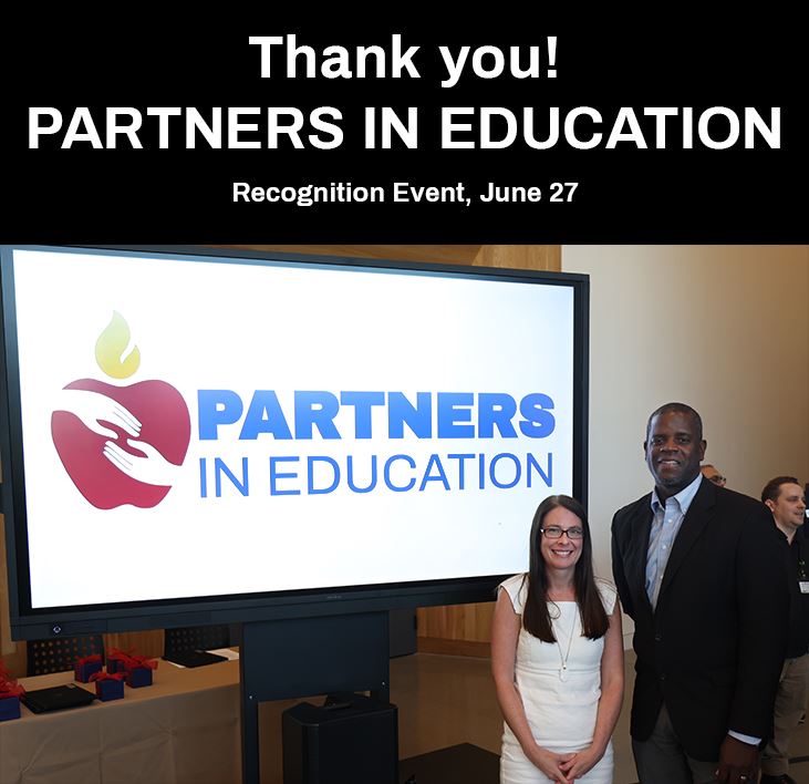  Ashley Trevino and Marcus Freeman Sr. with PIE signage at recognition event