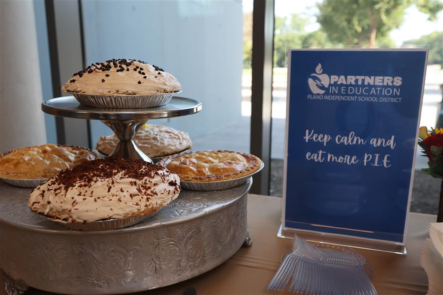 Yummy pies on display with signage.