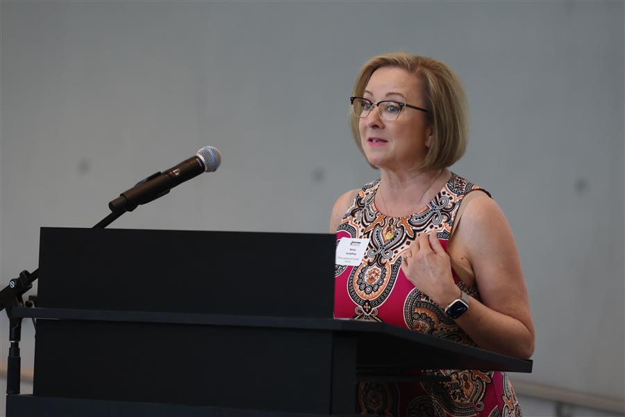 PISD Board President Nancy Humphrey, at event podium