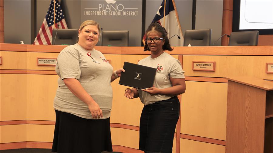 Marcie Bell receives certificate from Sr. Exec. Director of the PISD Foundation, Brittnea Ussery