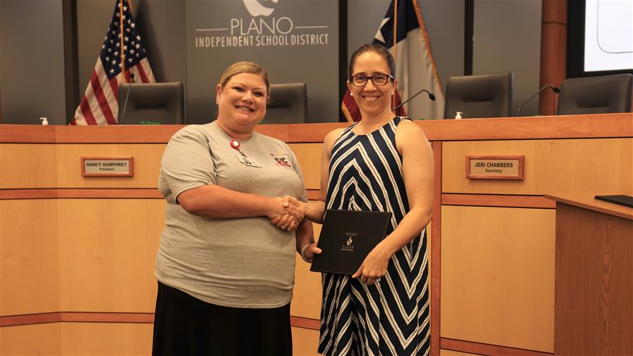Katy Brandeland receives certificate from Brittnea Ussery Senior Executive Director PISD Education Foundation