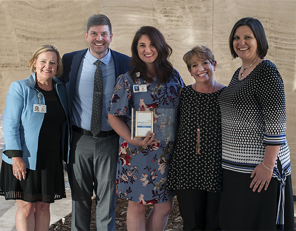 Prof Learning staff with award from Learning Forward Texas